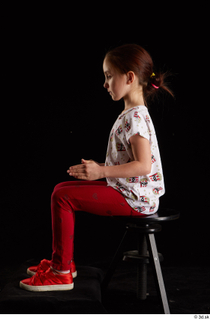 Lilly  1 dressed red leggings red shoes sitting t…